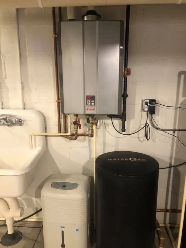 Wall-mounted tankless water heater installed in a customer’s home